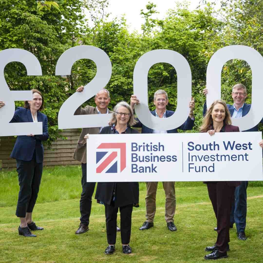 group picture of the fund managers for the South West Investment Fund pictured holding a £200 million sign and British Business Bank logos. 