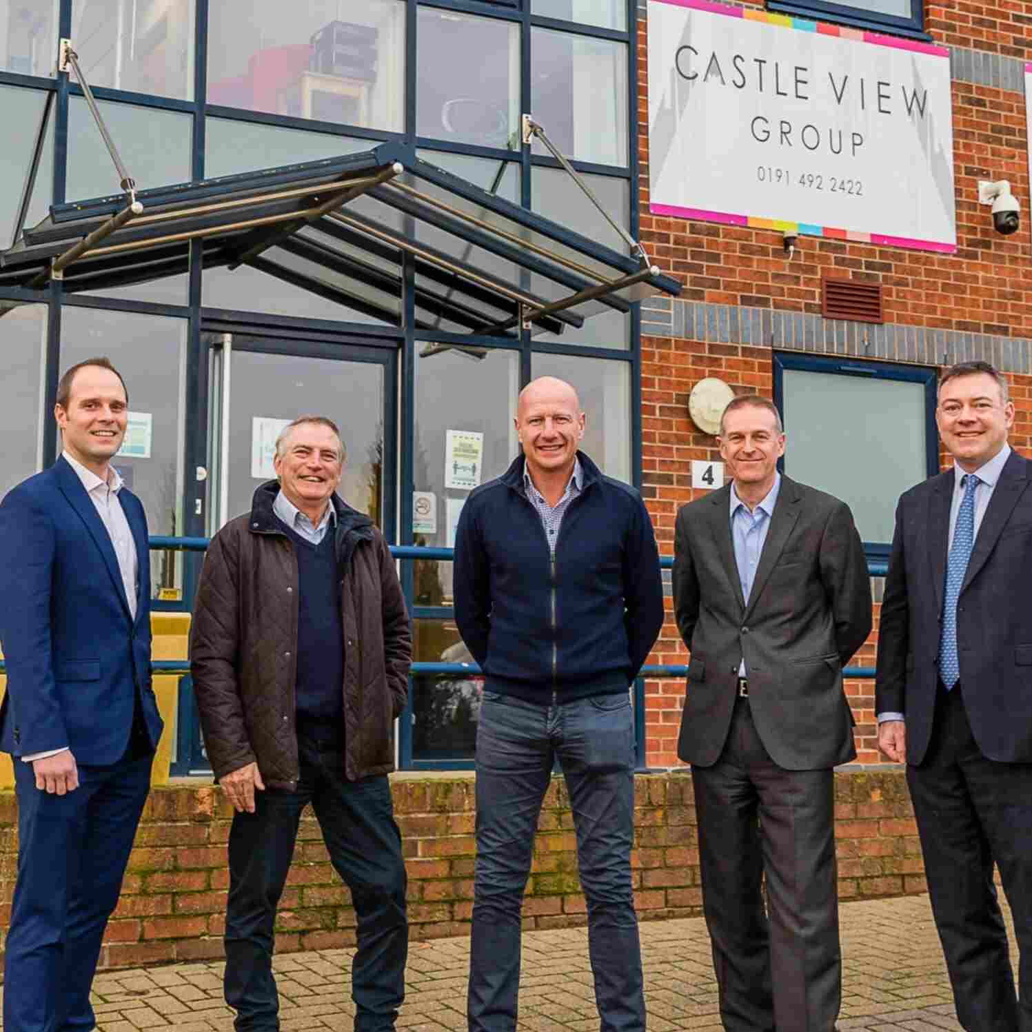 Picture of some of Maven's Investment team with the owners of Castle View Group outside their office